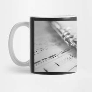 Wooden flute on sheet music Mug